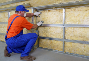 Worker Installing Insulation
